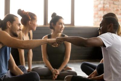 Smiling,Sporty,Fit,African,American,And,Caucasian,Men,Fist,Bumping